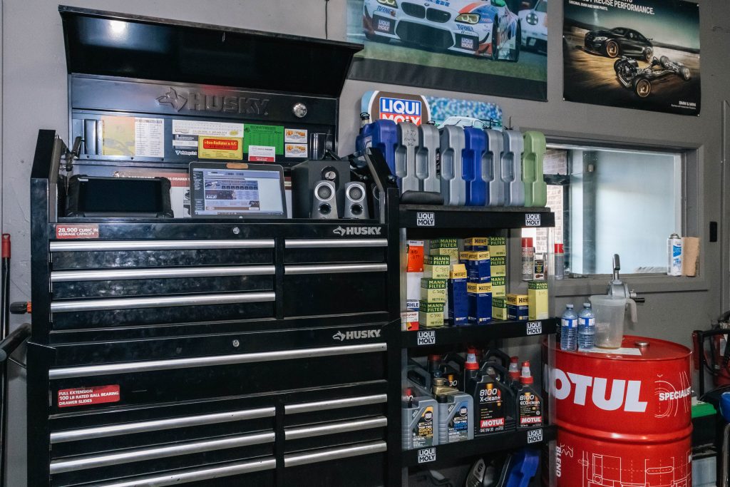 Car on hydraulic lift inside Active Autozone's North York shop